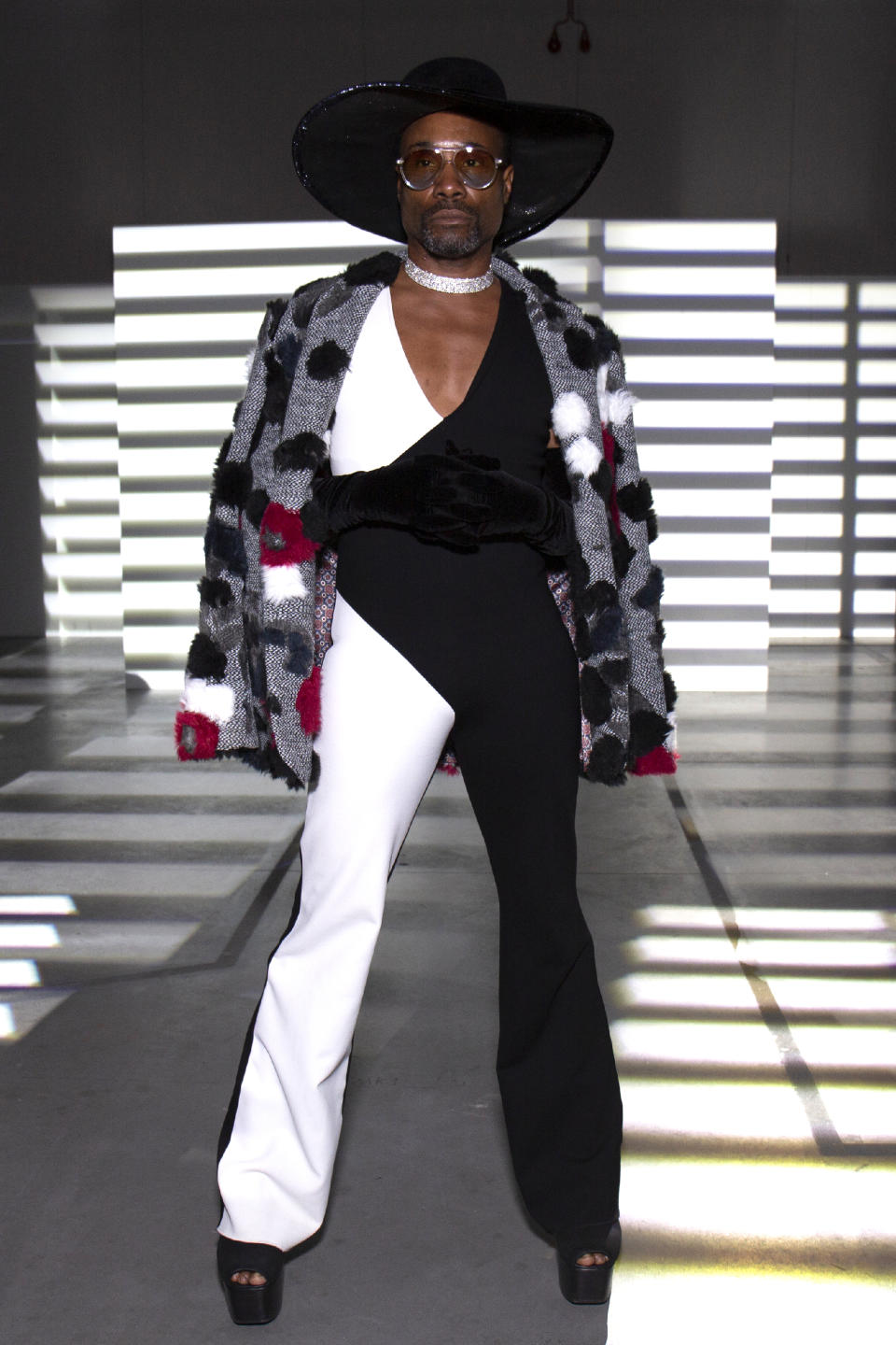 On Sunday, the actor opted for a black and white monochrome jumpsuit with a black cowboy hat at the PREEN by Thornton Bregazzi show [Photo: Getty Images]