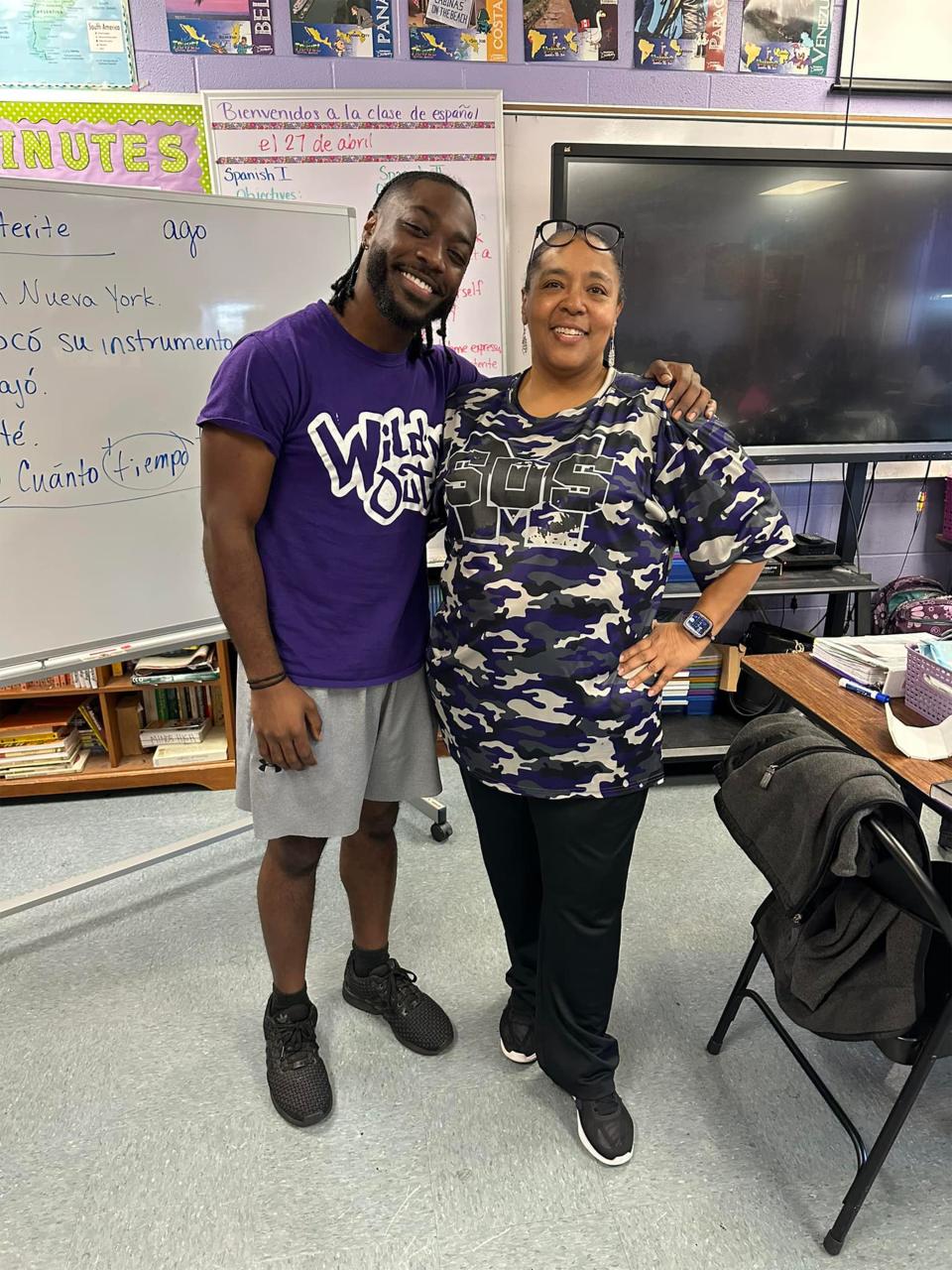 Mulga native D.Smooth, a finalist on season 23 of "The Voice" visits with his former Spanish teacher Cotrena Moseley at Minor High School earlier this month.