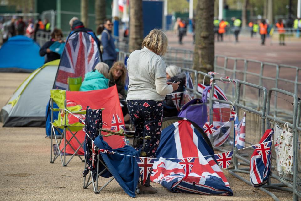 The Mall, London, UK. 4th May, 2023. Two days before the Coronation of King Charles III preparations continue on The Mall for the procession with more Royal watchers arriving to camp out over two nights in spite of heavy rain being forecast. Credit: Malcolm Park/Alamy Live News