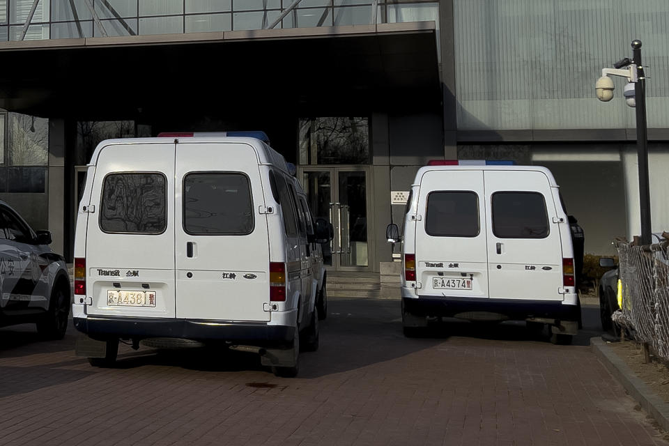 Police vehicles parked outside the headquarters of the Zhongzhi Enterprise Group Co. in Beijing, Monday, Jan. 8, 2024. A top executive of China Evergrande's electric vehicle company has been detained by police in the latest sign of trouble for the world's most heavily indebted property developer. That followed news over the weekend that Zhongzhi Enterprise Group, a major shadow bank in China that has lent billions in yuan (dollars) to property developers, filed for bankruptcy liquidation after it was unable to pay its debts. (AP Photo/Andy Wong)