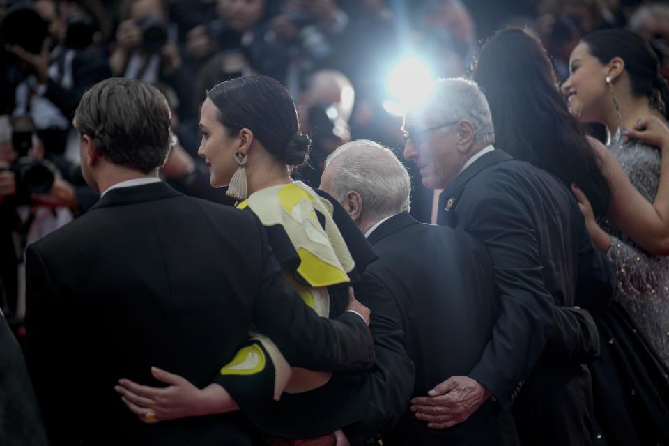 Leonardo DiCaprio, from left, Lily Gladstone, director Martin Scorsese, Robert De Niro, Cara Jade Myers, and Janae Collins pose for photographers upon arrival at the premiere of the film 'Killers of the Flower Moon' at the 76th international film festival, Cannes, southern France, Saturday, May 20, 2023. (AP Photo/Daniel Cole)