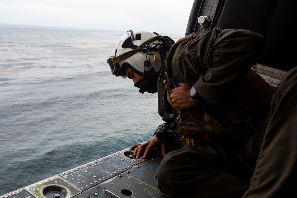 A crewmember is shown looking for a sunken AAV in Southern California earlier this summer. / Credit: 15th Marine Expeditionary Unit