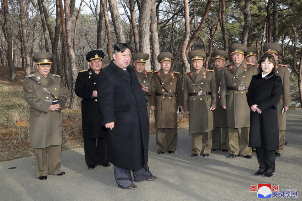 In this photo provided by the North Korean government, North Korean leader Kim Jong Un, with his daughter, provides guidance to military officials at an undisclosed location in North Korea, Thursday, March 9, 2023. Independent journalists were not given access to cover the event depicted in this image distributed by the North Korean government. The content of this image is as provided and cannot be independently verified. Korean language watermark on image as provided by source reads: "KCNA" which is the abbreviation for Korean Central News Agency. (Korean Central News Agency/Korea News Service via AP)