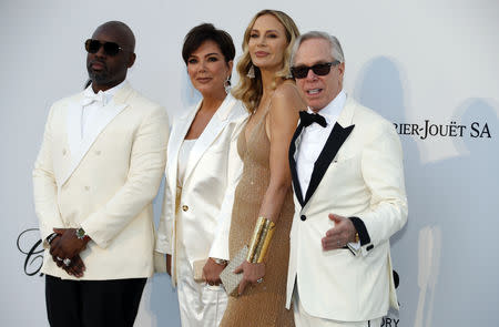 72nd Cannes Film Festival - The amfAR's Cinema Against AIDS 2019 event - Antibes, France, May 23, 2019. Tommy Hilfiger and Dee Ocleppo pose with Kris Jenner and Corey Gamble. REUTERS/Eric Gaillard