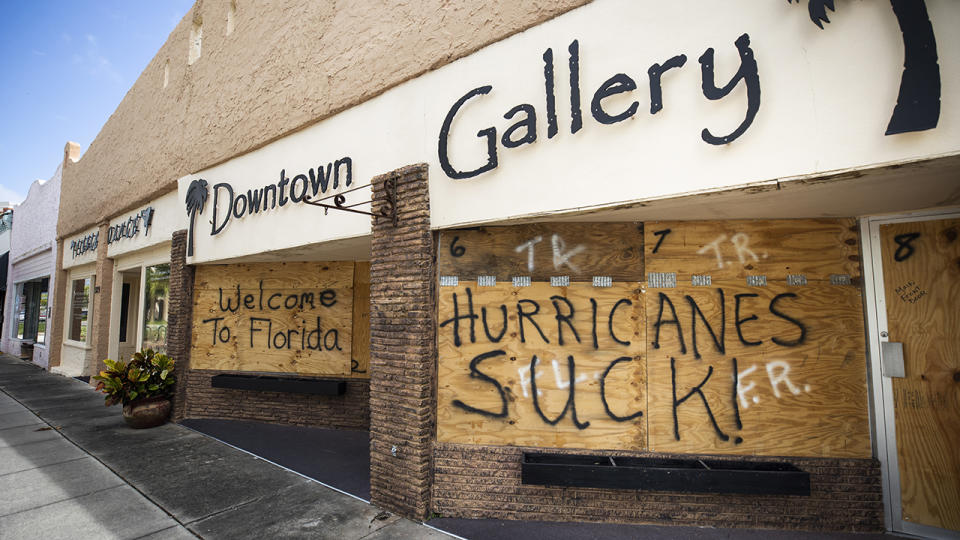 Plywood protectors over windows carry a message for Hurricane Dorian in Titusville, Florida. The hurricane has already made landfall in the Bahamas.