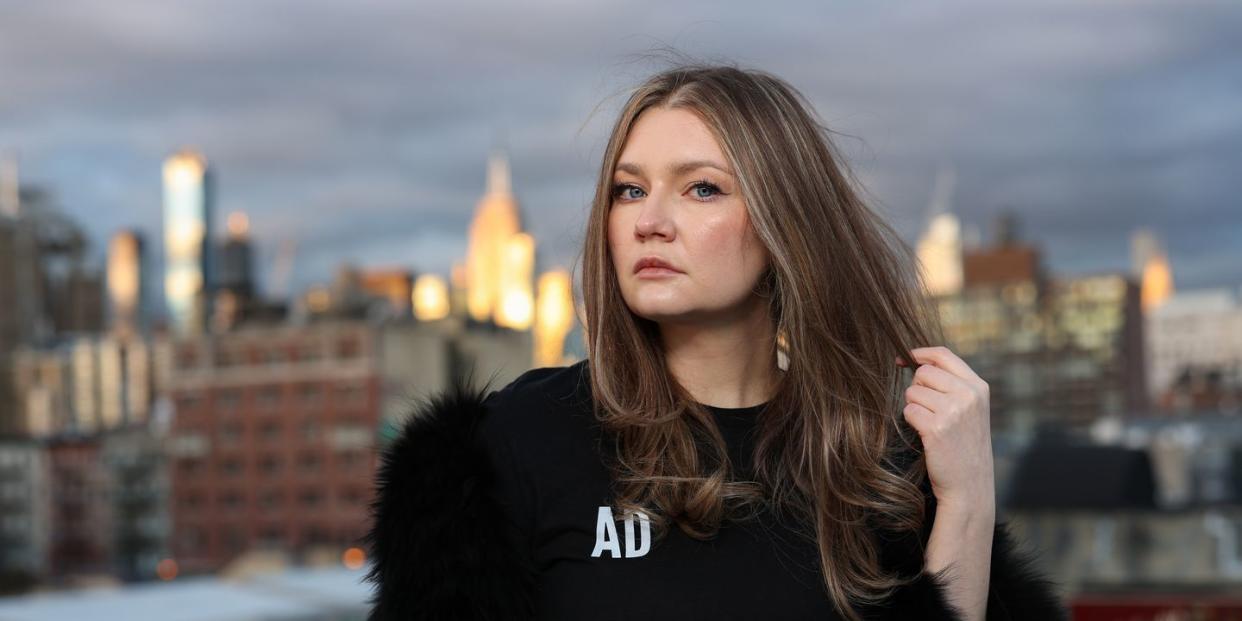 anna delvey poses for a portrait in her home