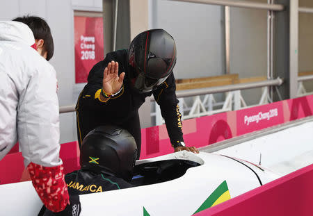 Bobsleigh - Pyeongchang 2018 Winter Olympics - Women's Training - Olympic Sliding Centre - Pyeongchang, South Korea - February 18, 2018 - Jazmine Fenlator-Victorian and Carrie Russell of Jamaica interact after their run. REUTERS/Edgar Su