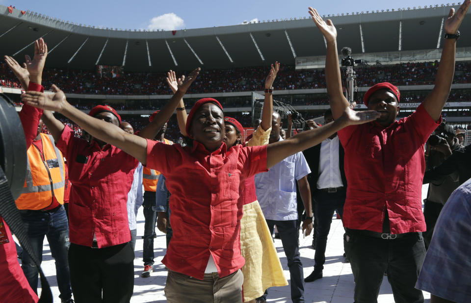 Leader of the Economic Freedom Fighters (EFF) party, Julius Malema, greets supporters as he arrives at the Orlando Stadium in Soweto, South Africa, Sunday, May 5, 2019. Campaigning for South Africa’s upcoming election have reached a climax Sunday with mass rallies by the ruling party and one of its most potent challengers. (AP Photo/Themba Hadebe)