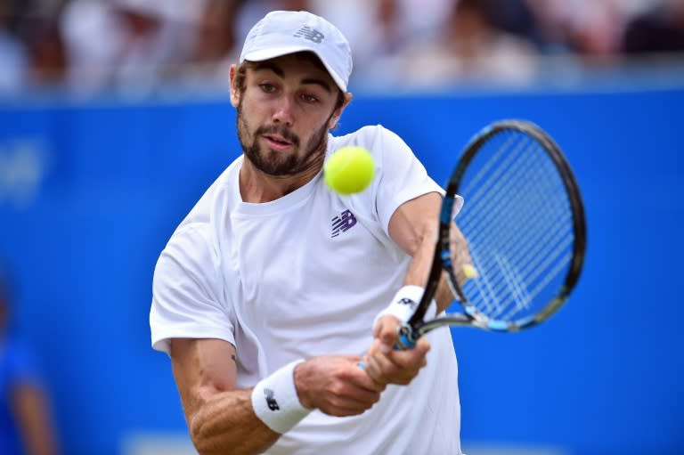 Australia's Jordan Thompson returns to Sam Querrey of the US during their men's singles second round tennis match at the ATP Aegon Championships tennis tournament at Queen's Club in west London on June 22, 2017