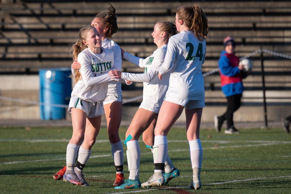 Sutton players celebrate after Ava Magnuson, left, scores to put the Suzies up, 2-1, over Monson in the Division 5 girls' soccer final.