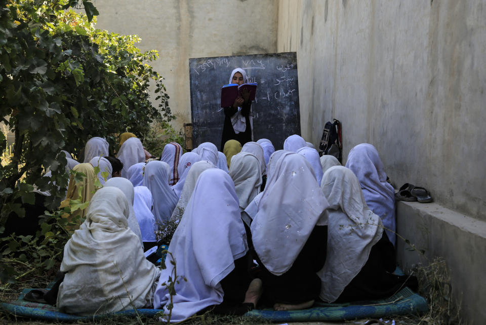 FILE - in this Wednesday, Oct. 7, 2020, students attend an open air class at a primary school in Kabul, Afghanistan, An Afghan education ministry memo banning girls, 12 years old and older, from singing at public school functions, which the education ministry tells The Associated Press was a mistake, is causing a social media stir. (AP Photo/Mariam Zuhaib, File)