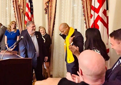 Gov. Wes Moore, center, joins Maryland mayors after a security threat closed the state government complex Thursday in Annapolis.