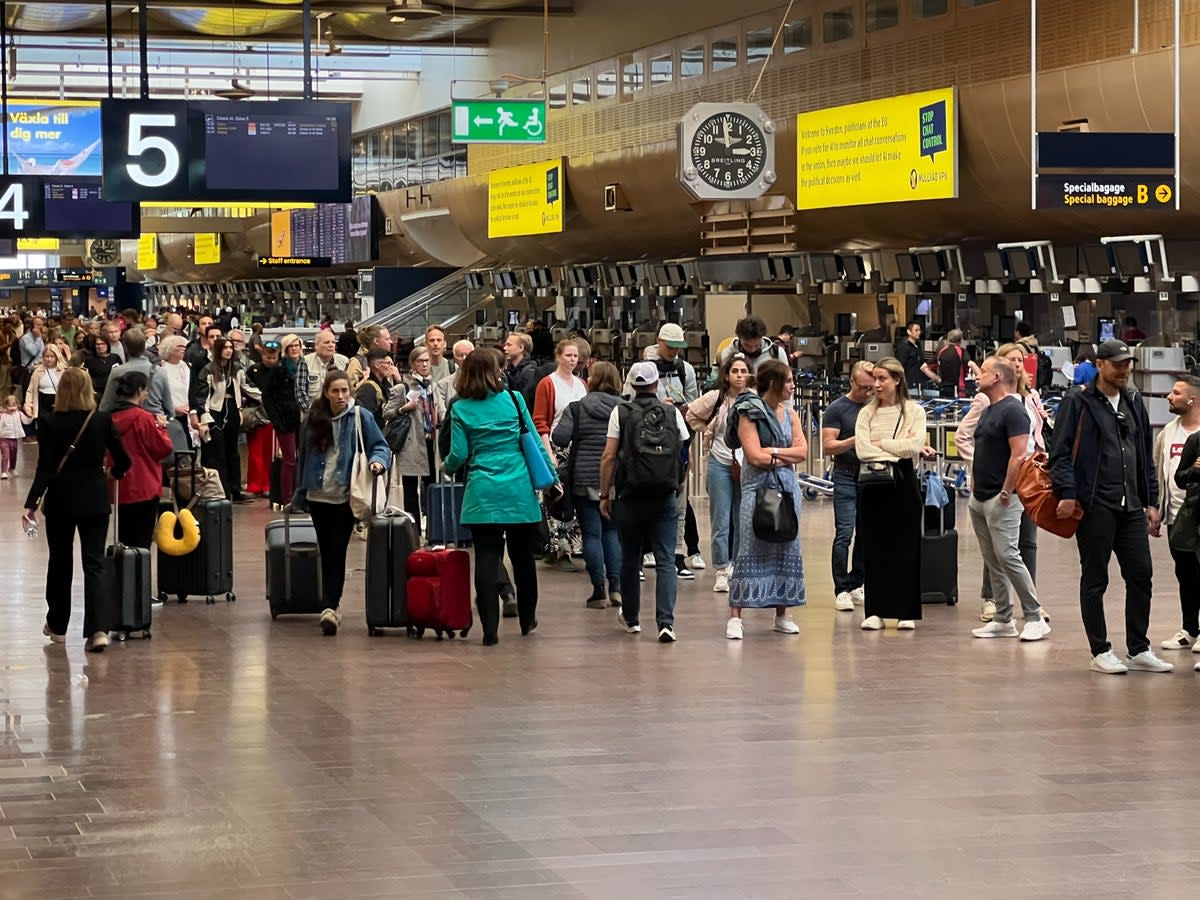 Departing soon? Passengers at Stockholm Arlanda airport – and yes, that long line of people is the queue for security  (Simon Calder)