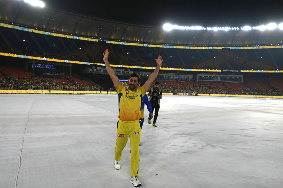 Chennai Super Kings' captain MS Dhoni acknowledges the applause from the crowd after their win in the Indian Premier League final cricket match against Gujarat Titans in Ahmedabad, India, Tuesday, May 30, 2023. (AP Photo/Ajit Solanki)