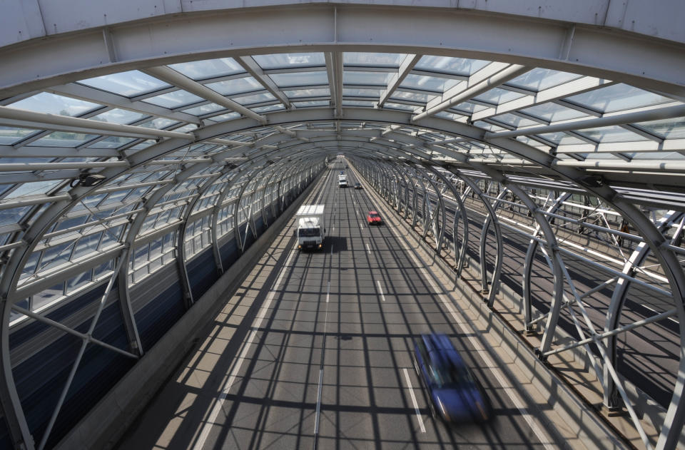 Cars drive through a soundproof tunnel covering a highway in Warsaw, Poland, Wednesday, April 30, 2014, one of the many investments built with the help of European Union funds. Poland joined the European Union a decade ago, a time that made monumental changes in the country as well as in some other former Soviet satellite states in east and central Europe. (AP Photo/Alik Keplicz)