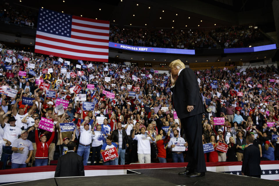 In this Oct. 22, 2018 photo, President Donald Trump blows a kiss as he arrives for a campaign rally for Sen. Ted Cruz, R-Texas, at Houston Toyota Center in Houston. Trump was kicking off an 8-state campaign blitz on Wednesday, seeking to shore up Senate Republicans against an onslaught of Democratic surrogates entering the midterm campaign's final weekend.(AP Photo/Evan Vucci)