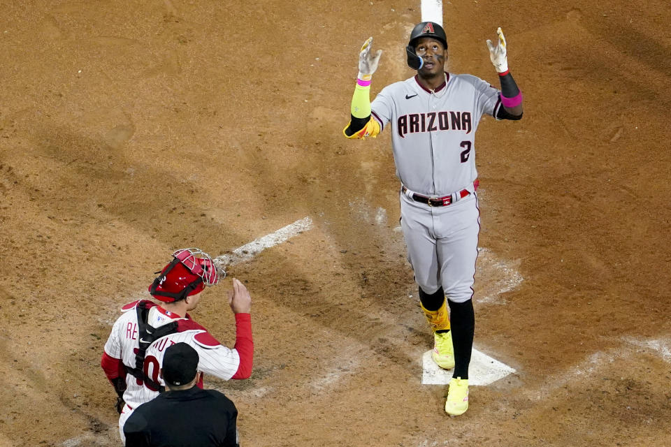 Arizona Diamondbacks' Geraldo Perdomo celebrates after his two-run home run against the Philadelphia Phillies during the sixth inning in Game 1 of the baseball NL Championship Series in Philadelphia, Monday, Oct. 16, 2023. (AP Photo/Matt Slocum)