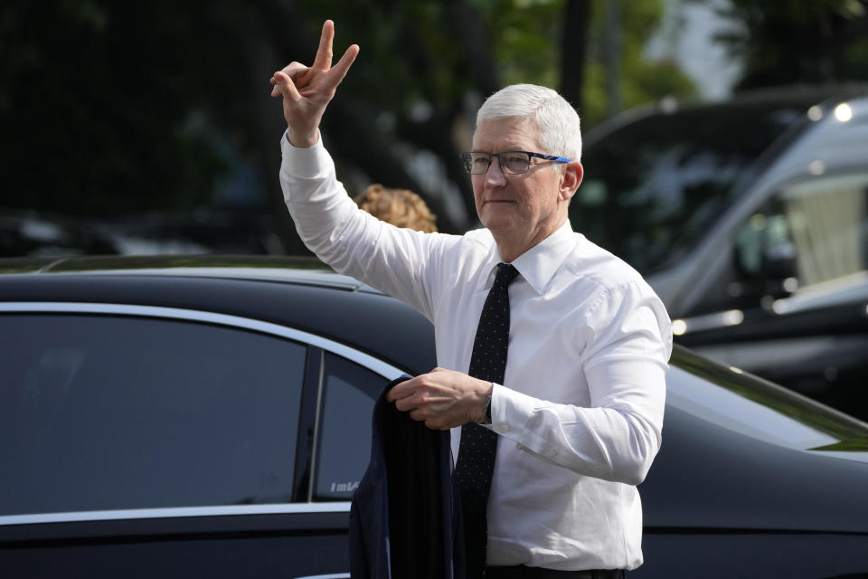 Apple CEO Tim Cook gestures upon arrival for a meeting with Indonesian President Joko Widodo at the palace in Jakarta, Indonesia, Wednesday, April 17, 2024. (AP Photo/Achmad Ibrahim)