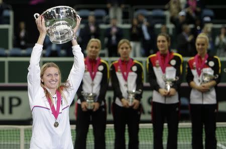 Czech Republic's Petra Kvitova celebrates with the trophy after winning the Fed Cup tennis tournament against Germany in Prague November 9, 2014. REUTERS/David W Cerny