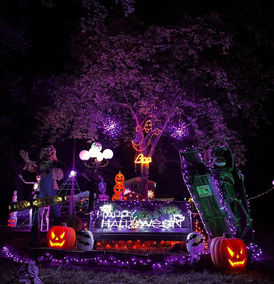 Halloween decorations illuminate the front yard of 1949 N. Farm Road 97 in Springfield.