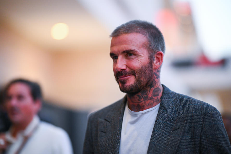 David Beckham wears white T-shirt and jacket