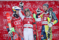 Skiing - Men's Alpine Ski World Cup Slalom - Val d´Isere, France - December 10, 2017 Austria's Marcel Hirscher celebrates with second placed Norway's Henrik Kristofferson and third placed Sweden's Andre Myhrer on the podium after winning the Men's Alpine Ski World Cup Slalom REUTERS/Christian Hartmann