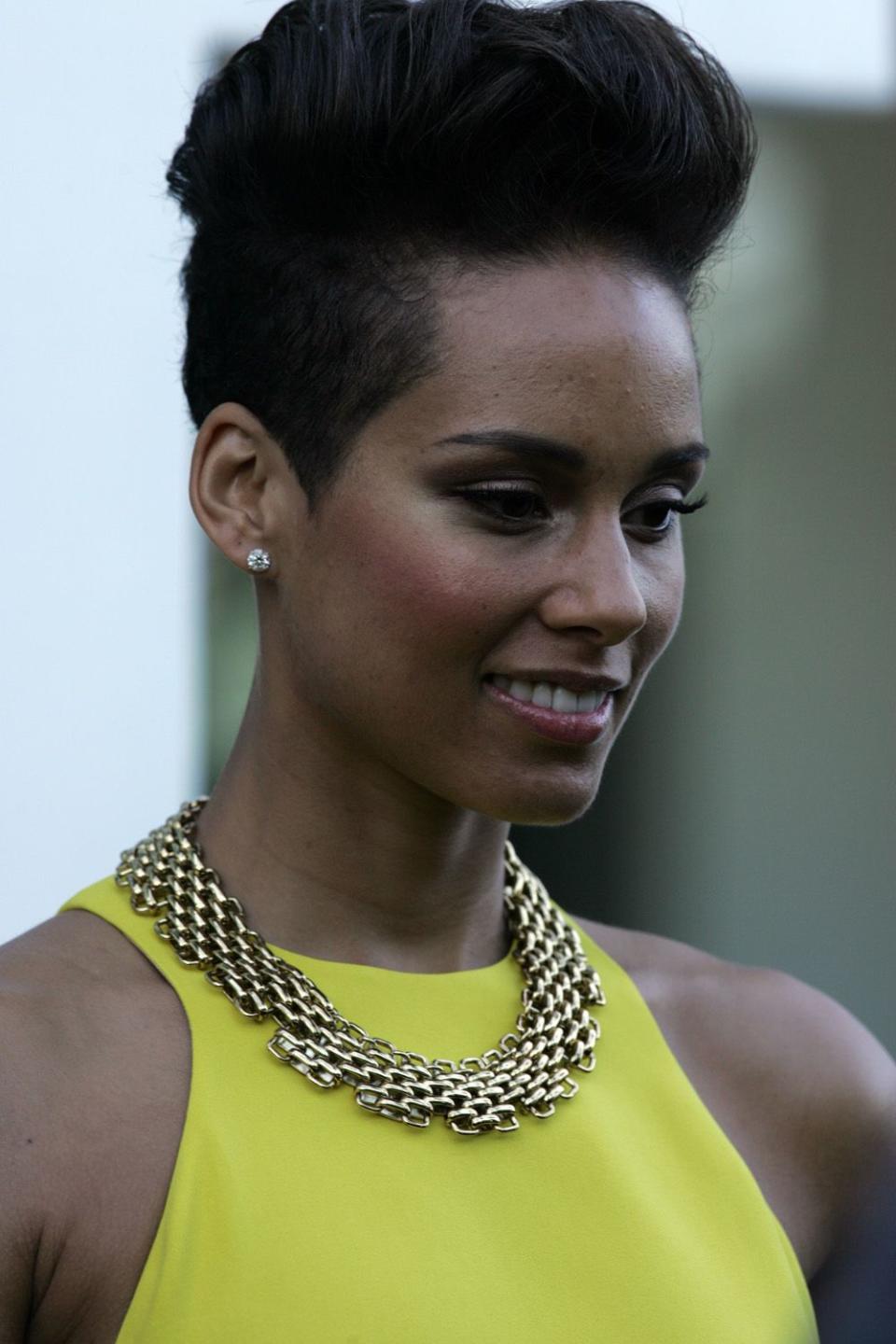 Age has nothing on Alicia Keys as she looks breath-taking in a long yellow dress/