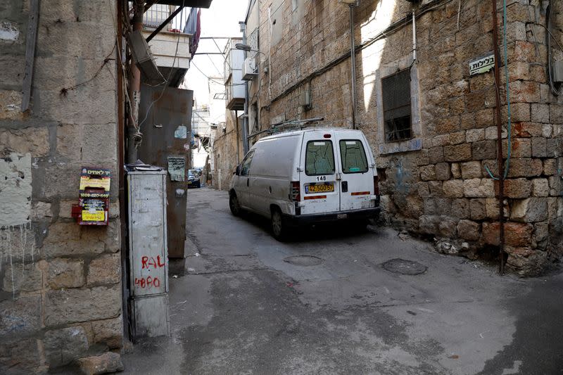 A street corner in Jerusalem's Mea Shearim neighbourhood where Ultra-Orthodox Jewish men sort their cooking utensils at they dip them in boiling water to remove remains of leaven in preparation for the Jewish holiday of Passover, seen deserted amid the cor