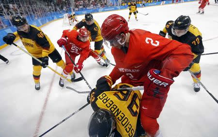 Ice Hockey - Pyeongchang 2018 Winter Olympics - Men Final Match - Olympic Athletes from Russia v Germany - Gangneung Hockey Centre, Gangneung, South Korea - February 25, 2018 - Germany's Yannic Seidenberg and Artyom Zub, an Olympic Athlete from Russia, compete. REUTERS/Kim Kyung-Hoon