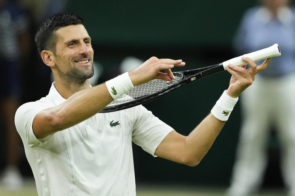 Novak Djokovic of Serbia celebrates after defeating Holger Rune of Denmark in their fourth round match at the Wimbledon tennis championships in London, Monday, July 8, 2024. (AP Photo/Mosa'ab Elshamy)