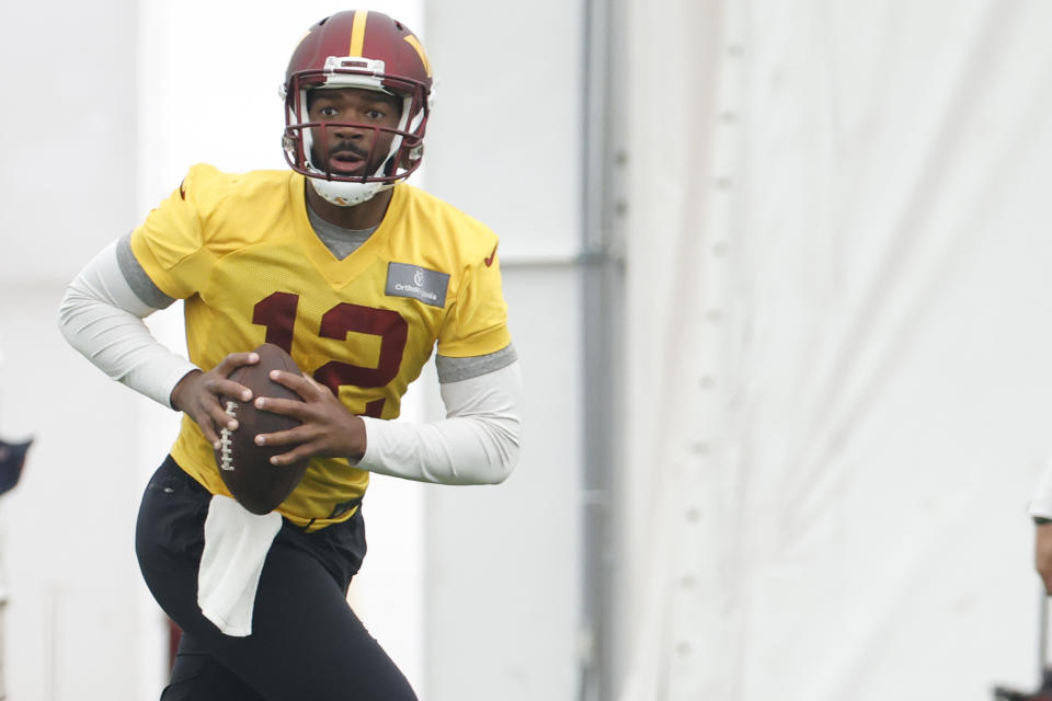 Washington Commanders quarterback Jacoby Brissett (12) prepares to pass the ball during day three of minicamp. Mandatory Credit: Geoff Burke-USA TODAY Sports