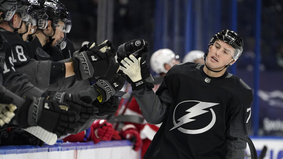 Tampa Bay Lightning left wing Ross Colton (79) celebrates with the bench after his goal against the Detroit Red Wings during the first period of an NHL hockey game Saturday, April 3, 2021, in Tampa, Fla. (AP Photo/Chris O'Meara)