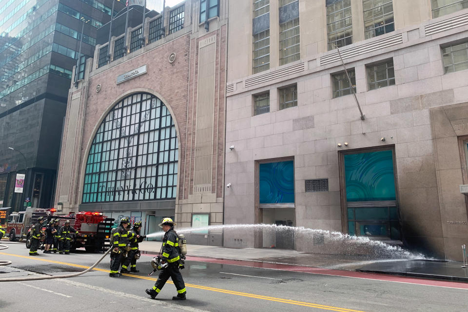 Firefighters outside New York's Tiffany flagship store that caught fire Thursday morning. (Matt Nighswander / NBC News)