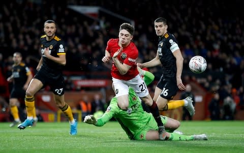 Manchester United's Daniel James collides with Wolverhampton Wanderers goalkeeper John Ruddy - Credit: PA