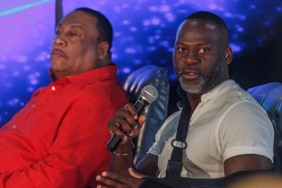 Carl Boldin, left, and Abe Elam sit for a panel discussion Sunday on raising successful Black men. The forum was held at Redemptive Life Academy in West Palm Beach.