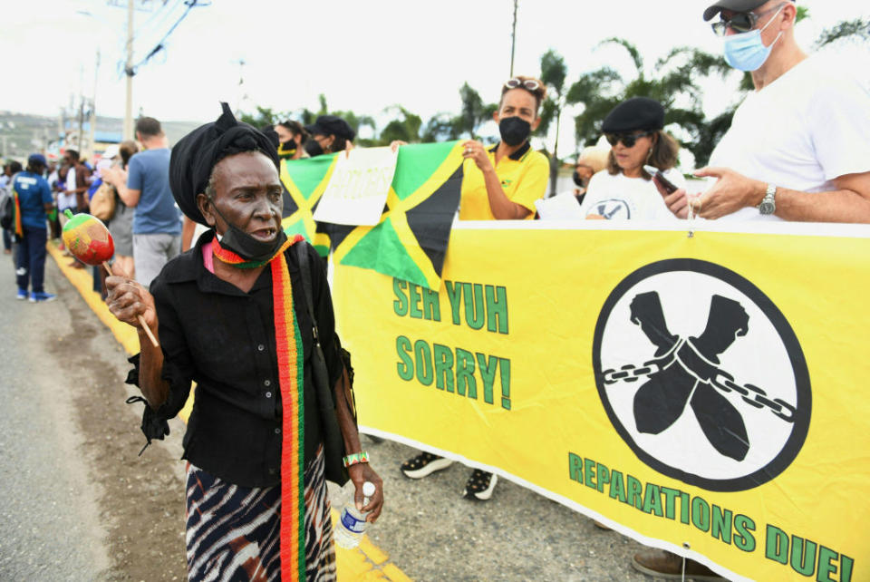 People calling for slavery reparations, protest outside the entrance of the British High Commission during the visit of the Duke and Duchess of Cambridge in Kingston, Jamaica on March 22 2022.<span class="copyright">Ricardo Makyn—AFP/Getty Images</span>