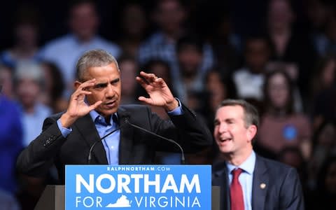 Former US President Barack Obama speaks during a campaign rally for Ralph Northam (R) in Richmond - Credit: AFP