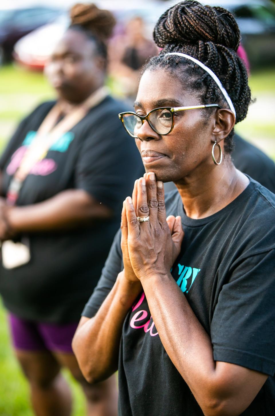 War Cry 4 Peace Executive Director Kimberly Wilkerson prays Thursday during a vigil to honor Ronnie "P nut" James Jr.