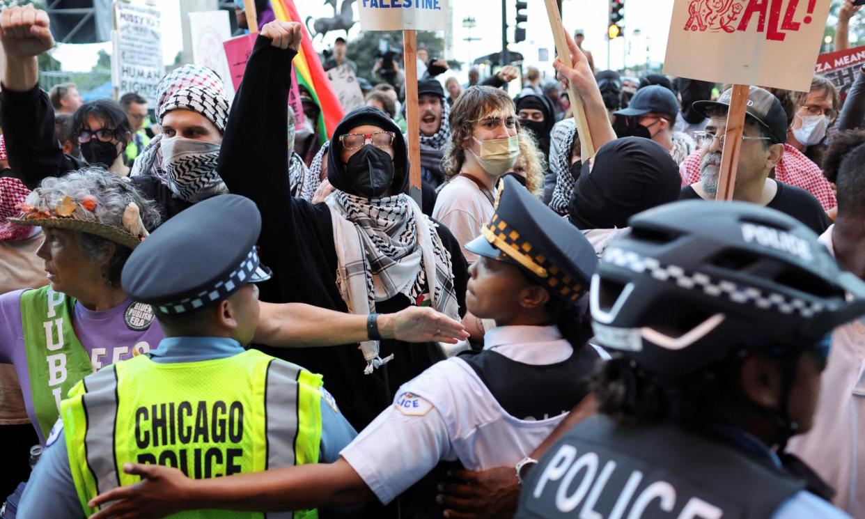 <span>People take part in a protest organised by pro-choice rights, pro-LGBT rights and pro-Palestinian activists, in Chicago, ahead of the Democratic National Convention.</span><span>Photograph: Marco Bello/Reuters</span>