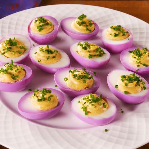<p><a href="https://www.delish.com/cooking/recipe-ideas/recipes/a58284/how-to-make-perfect-hard-boiled-eggs/" rel="nofollow noopener" target="_blank" data-ylk="slk:Hard-boiled eggs" class="link ">Hard-boiled eggs</a> get pickled with <a href="https://www.delish.com/cooking/g39298849/red-cabbage-recipes/" rel="nofollow noopener" target="_blank" data-ylk="slk:purple cabbage" class="link ">purple cabbage</a> to dye the whites naturally and a little Cajun seasoning goes in the yolk mixture to make these <a href="https://www.delish.com/cooking/recipe-ideas/a51851/classic-deviled-eggs-recipe/" rel="nofollow noopener" target="_blank" data-ylk="slk:deviled eggs" class="link ">deviled eggs</a> New Orleans-approved! </p><p>Get the <strong><a href="https://www.delish.com/cooking/recipe-ideas/a30897099/mardi-gras-deviled-eggs-recipe/" rel="nofollow noopener" target="_blank" data-ylk="slk:Mardi Gras Deviled Eggs recipe" class="link ">Mardi Gras Deviled Eggs recipe</a></strong>.</p>