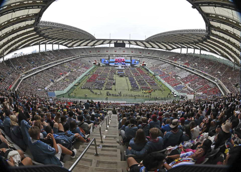 Attendees of the World Scout Jamboree attend the closing ceremony of the World Scout Jamboree at the World Cup Stadium in Seoul, South Korea, Friday, Aug. 11, 2023. Flights and trains resumed and power was mostly restored Friday after a tropical storm blew through South Korea, which was preparing a pop concert for 40,000 Scouts whose global Jamboree was disrupted by the weather. (Korea Pool via AP)