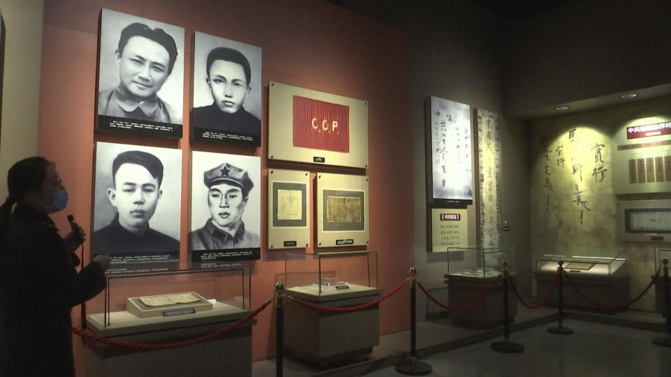 A tour guide leads a guided tour at the Jinggangshan Revolution Museum in Jinggangshan in southern China's Jiangxi province, on April 8, 2021. On the hundredth anniversary of the Chinese Communist Party, tourists in China are flocking to historic sites and making pilgrimages to party landmarks. (AP Photo/Emily Wang)