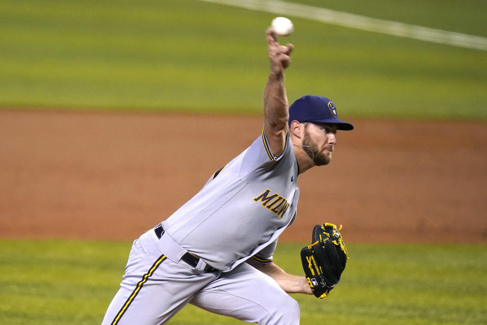 Milwaukee Brewers starting pitcher Adrian Houser throws during the first inning of a baseball game against the Miami Marlins, Saturday, May 8, 2021, in Miami. (AP Photo/Lynne Sladky)