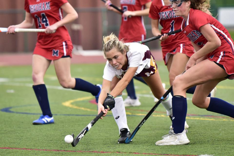 Ally Brosie, #7 of Madison extends her stick to catch a loose ball as she play against of Mendham in the first half during the NJSIAA Group 2 North field hockey opening-round match at Madison HS in Madison, Monday 10/31/22.
