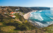 <p>The beaches of Portugal are long and varied. Rugged rocky bluffs border <a rel="nofollow noopener" href="https://www.tripadvisor.com/Attraction_Review-g1673801-d3860356-Reviews-Praia_da_Adraga-Sintra_Municipality_Lisbon_District_Central_Portugal.html" target="_blank" data-ylk="slk:Praia de Adraga;elm:context_link;itc:0;sec:content-canvas" class="link ">Praia de Adraga</a>, a 45-minute trip from Lisbon, while <a rel="nofollow noopener" href="https://www.tripadvisor.com/Attraction_Review-g660495-d2578100-Reviews-Comporta_Beach-Grandola_Setubal_District_Alentejo.html" target="_blank" data-ylk="slk:Comporta;elm:context_link;itc:0;sec:content-canvas" class="link ">Comporta</a> is a chic resort town reminiscent of the Hamptons. If that's not up to your speed, head three hours south to Salema, a quiet fishing village tucked into a cliffside along the Algarve Coast. Here, it's all about the whitewashed houses, local markets and seductive, drowsy rhythm.</p> <p><strong>Related:</strong> <a rel="nofollow noopener" href="http://www.jetsetter.com/feature/most-affordable-european-vacations?nm=magazine" target="_blank" data-ylk="slk:6 Most Affordable Cities in Europe;elm:context_link;itc:0;sec:content-canvas" class="link ">6 Most Affordable Cities in Europe</a></p>