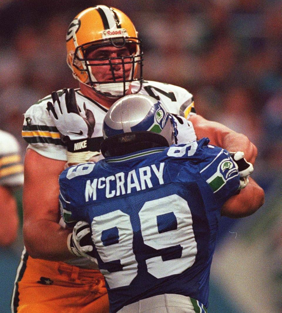 Packers tackle John Michels blocks Seattle's Michael McCrary.