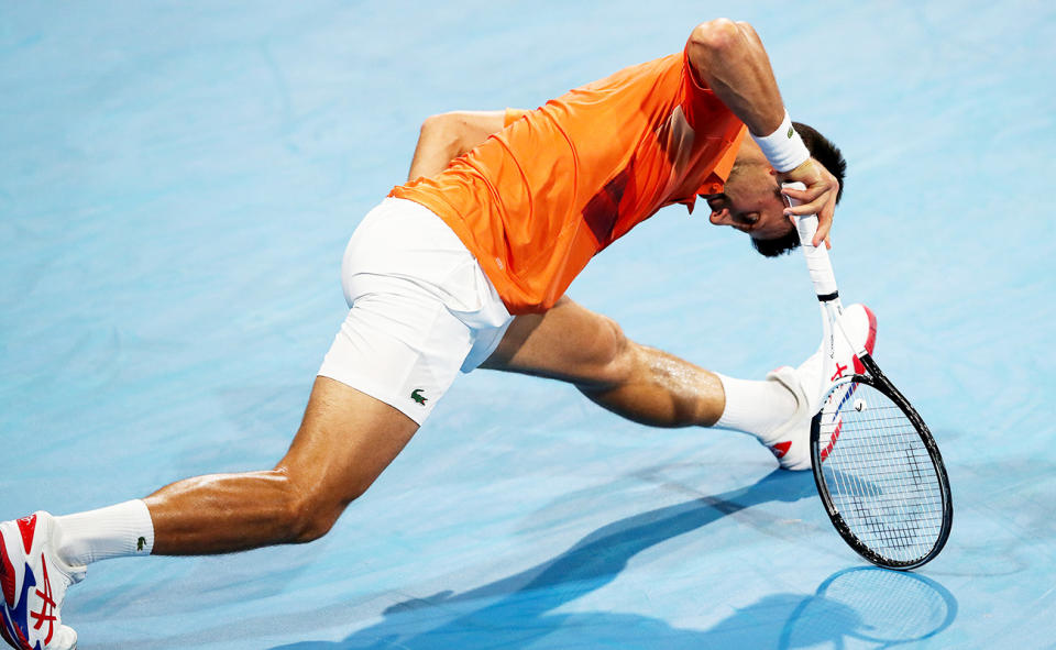 Novak Djokovic, pictured here stretching his hamstring during his win over Daniil Medvedev at the Adelaide International.