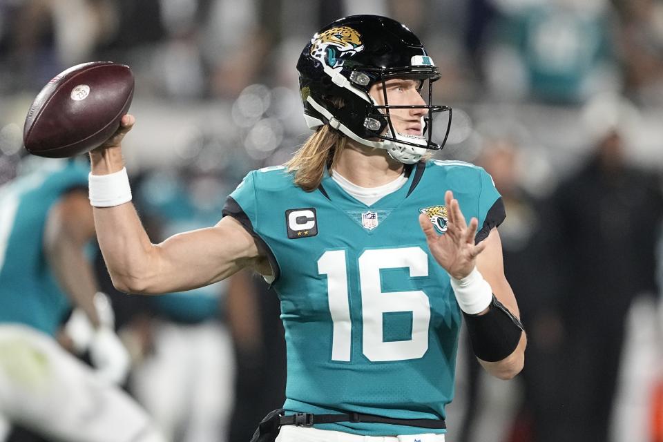 Jacksonville Jaguars quarterback Trevor Lawrence (16) sets back to pass during the first half of an NFL wild-card football game, against the Los Angeles Chargers, Saturday, Jan. 14, 2023, in Jacksonville.