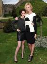 <p>Kristen Stewart poses with Charlize Theron at a photocell for Snow White and the Huntsman, May 2012.</p>