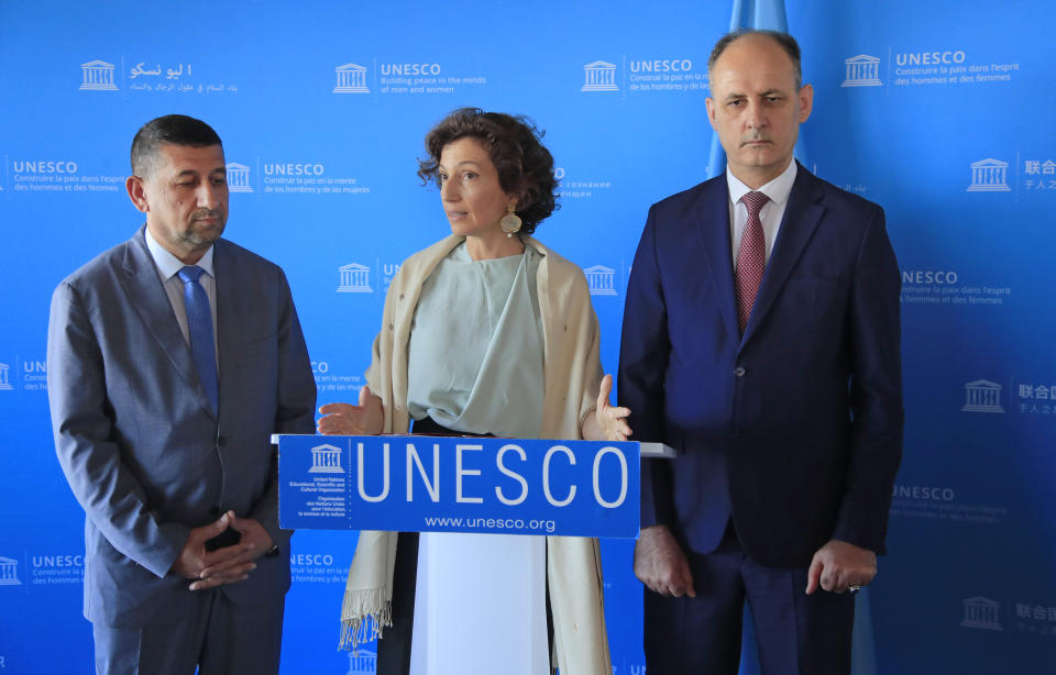 Governor of the province Nineveh Mansour al-Mareed, left, UNESCO'S Director-General Audrey Azoulay , center, and Iraq's Culture Minister Abdulamir al-Dafar Hamdani attend a media conference at the UNESCO's headquarters in Paris, Wednesday, Sept. 11. 2019. Iraqi officials meet at the UN's cultural agency in Paris to discuss plans for an ambitious $100 million reconstruction of the Islamic State-ravaged city of Mosul. (AP Photo/Michel Euler)